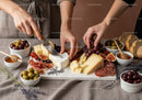 Elegant Cheese Platter with Fresh Grapes and Bread Slices