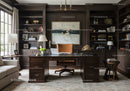 Elegant home office with dark wood furniture and art