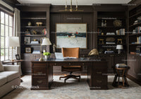 Elegant home office with dark wood furniture and art