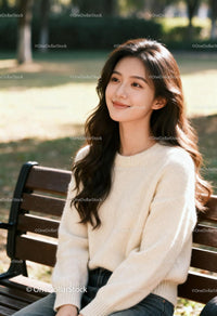 Young woman enjoying peaceful moment on park bench