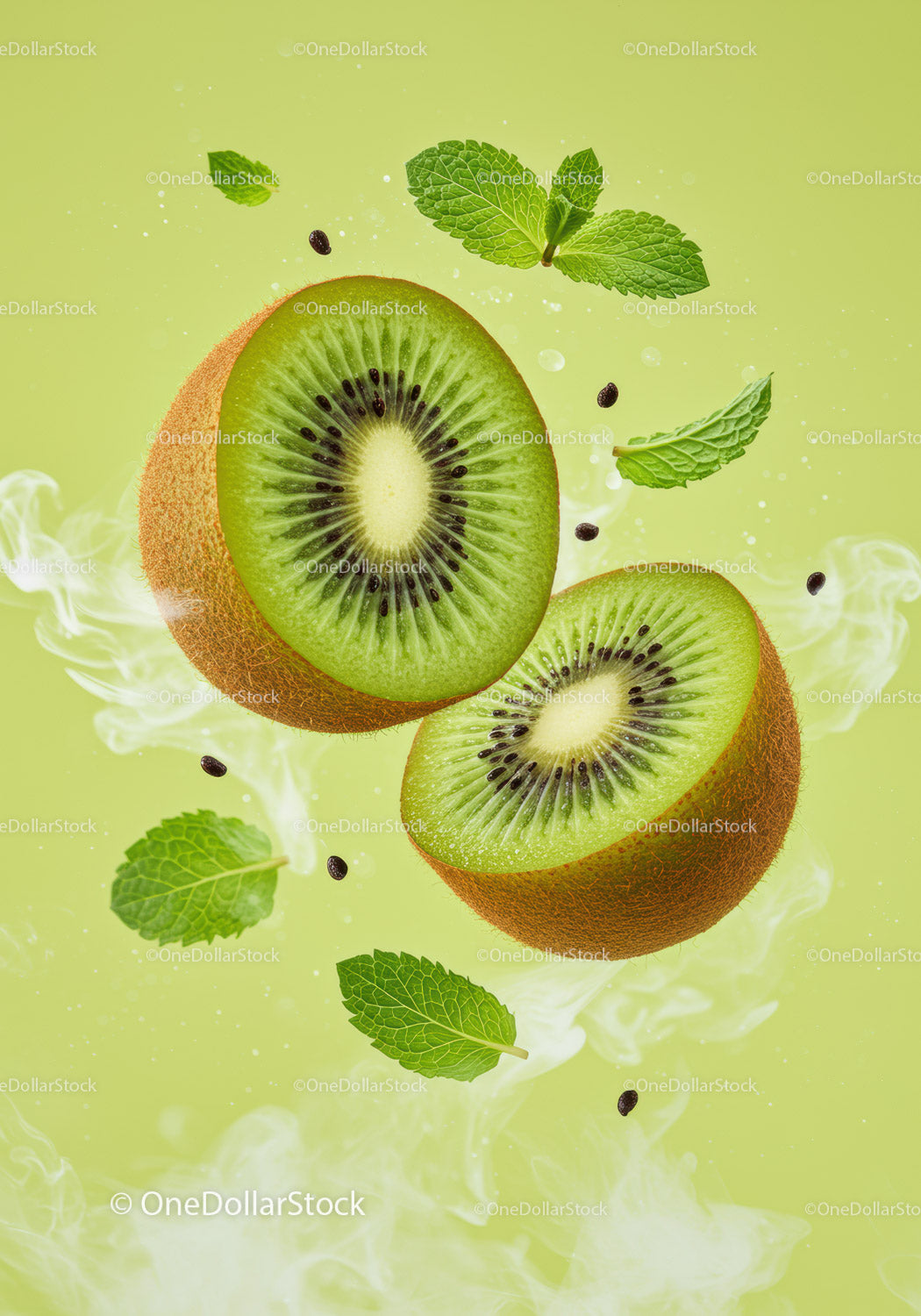 Fresh kiwi halves surrounded by mint leaves and mist