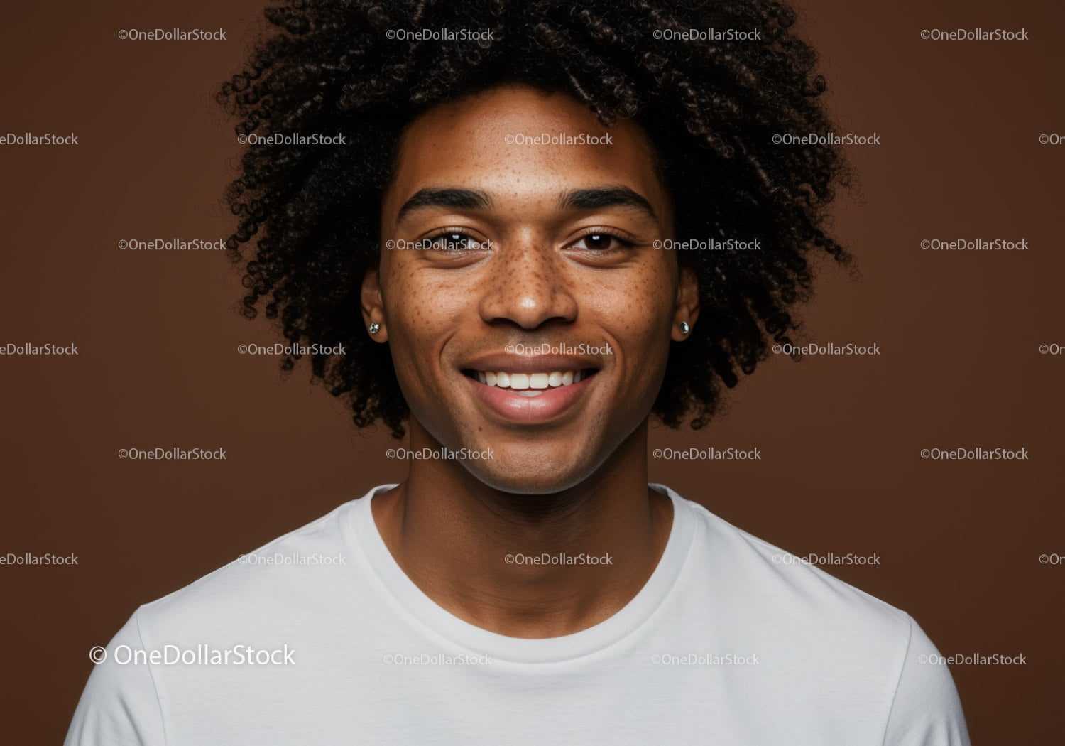 Portrait of Smiling Young Man with Afro Hairstyle in Studio