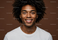 Portrait of Smiling Young Man with Afro Hairstyle in Studio