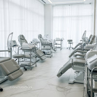Modern Hospital Room with Medical Equipment and Patient Chairs