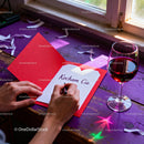 Writing a Romantic Valentine Card with Red Wine Glass