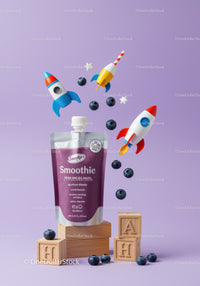 Blueberry Smoothie with Playful Rocket Toys and Wooden Blocks
