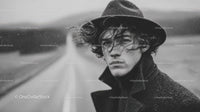 Black and White Portrait of Young Man with Windy Rainy Outdoors