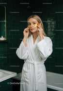 Young Woman with Gold Facial Masks in Spa Setting