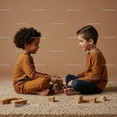 Two children playing with wooden blocks on soft rug