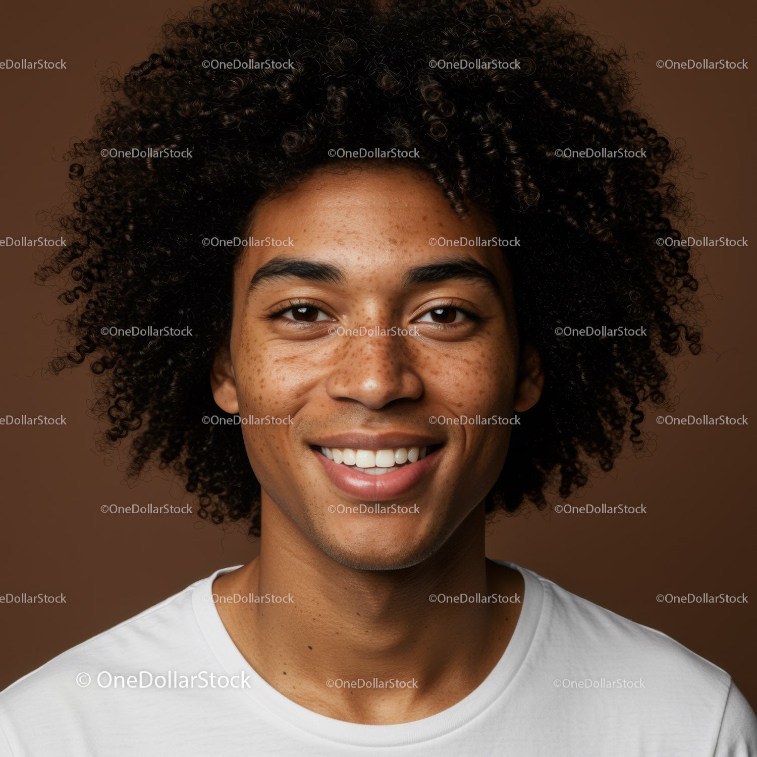 Portrait of a Smiling Young Man with Curly Hair and Bright Expression