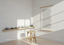 Minimalist corner with wooden stool and balanced stones