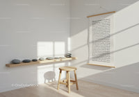 Minimalist corner with wooden stool and balanced stones