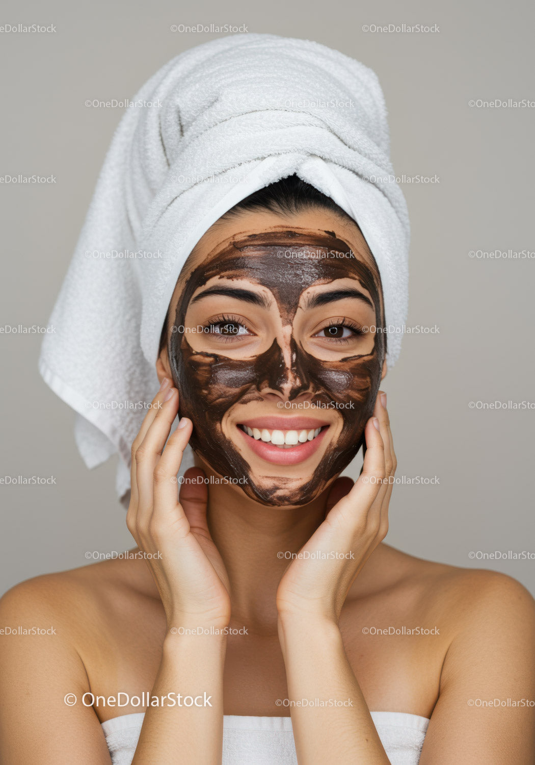 Young Woman Relaxing with Facial Mask and Towel Wrapped Head