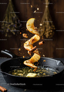 Spiral Apple Peel with Spices and Melting Butter in Pan
