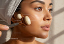 Woman Receiving Facial Massage with Jade Roller for Glowing Skin