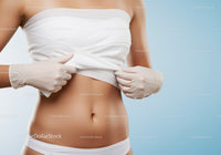 Close-Up of Woman Removing Bandage Showing Skin Healing Process