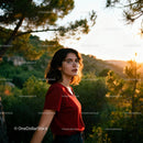 Young woman enjoying a sunset in the forest