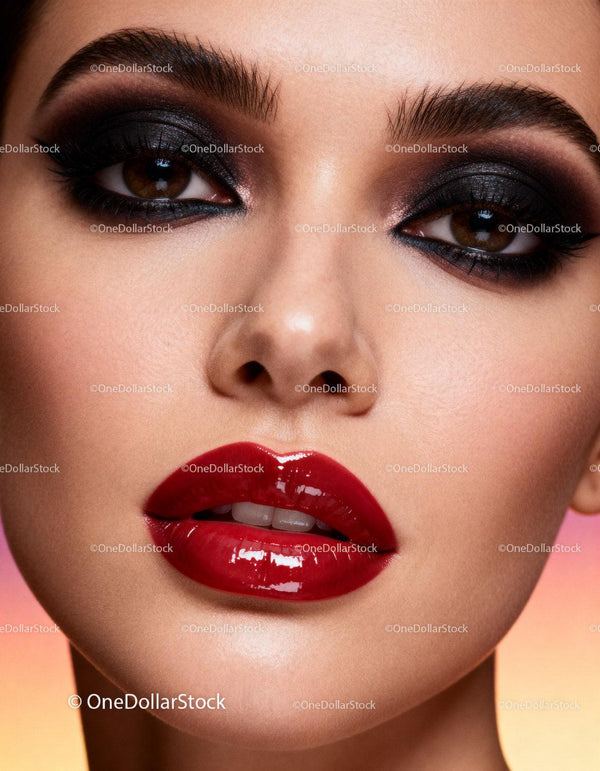 Close up of woman with glossy red lips and smoky eyes