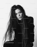 Black and White Portrait of a Woman with Long Hair and Intense Gaze