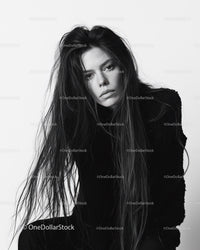 Black and White Portrait of a Woman with Long Hair and Intense Gaze