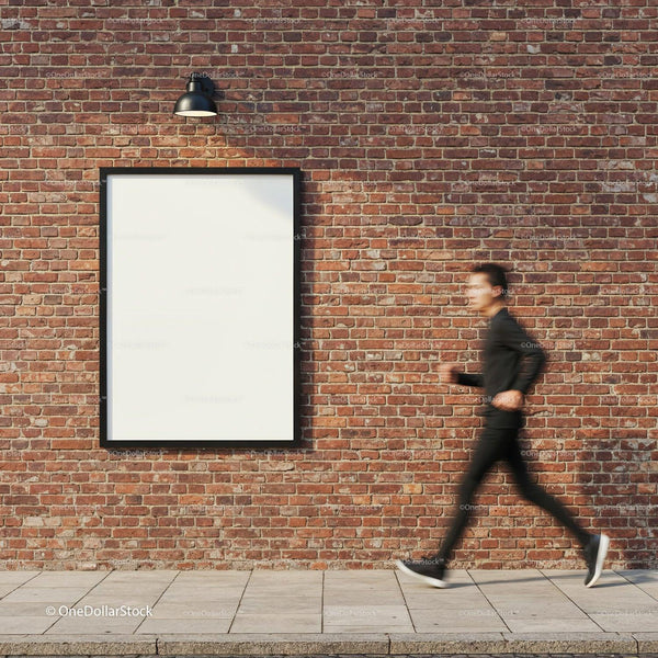 Motion blur of man passing empty billboard on brick wall JPG Mockup Image