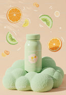 Refreshing green bottle on soft textured surface with fruits