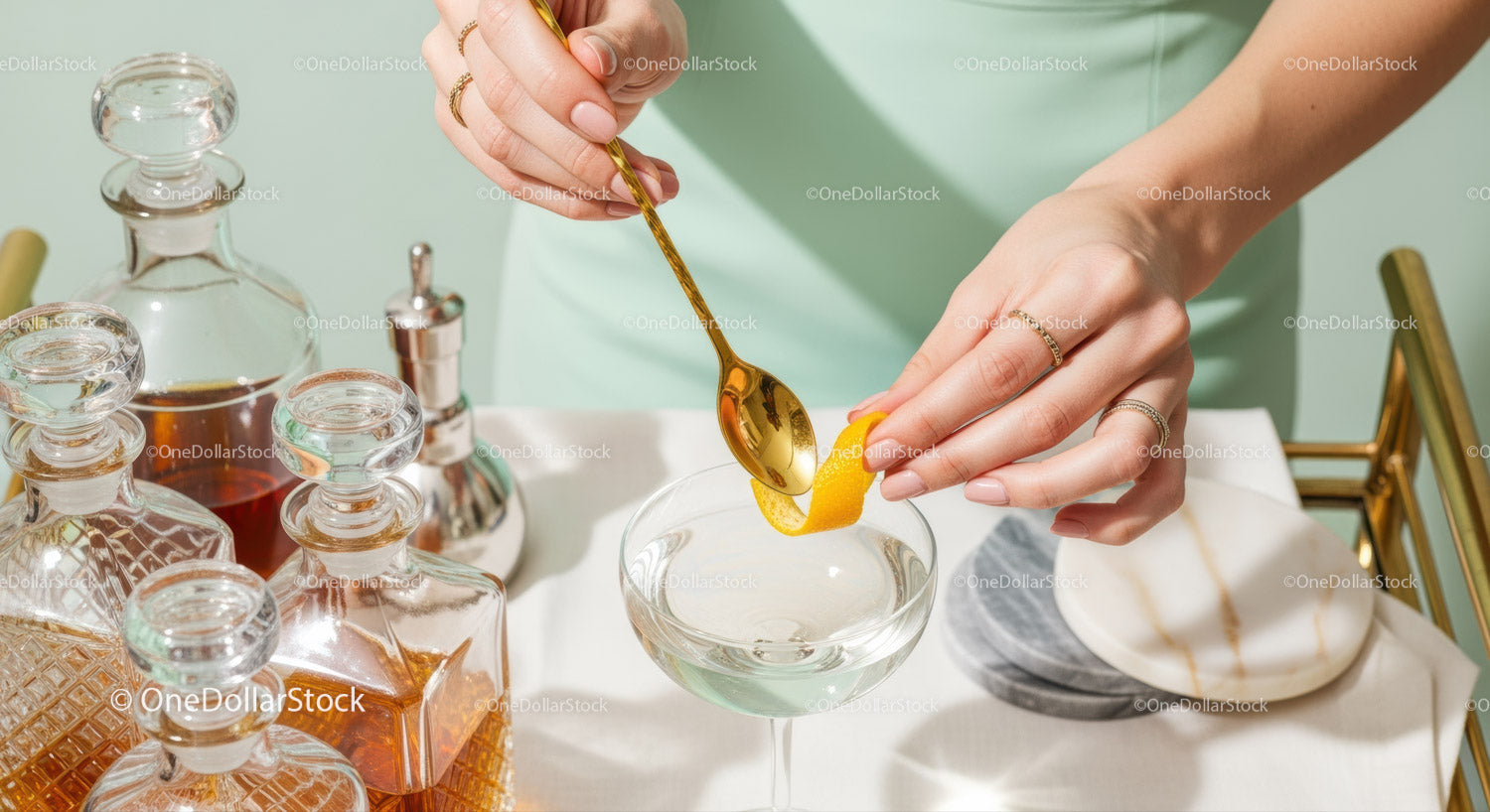 Elegant Cocktail Making with Lemon Peel and Gold Spoon in Bright Modern Bar