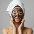 Young Woman Applying Mud Facial Mask in Spa Setting