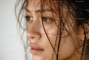 Close-up of a Woman with Wet Hair and Brown Eyes