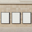 Three Blank Vertical Frames on Stone Wall Exterior