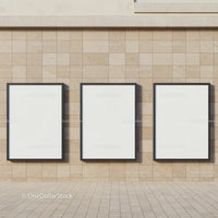 Three Blank Vertical Frames on Stone Wall Exterior