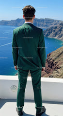 Man in Green Suit Overlooking Coastal Cliffs and Sea