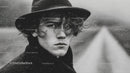Monochrome Portrait of a Young Man in Rain with Intense Expression