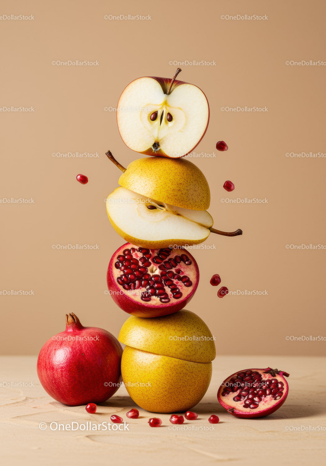 Stacked sliced fruits with pomegranate seeds on beige