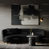 Modern black velvet sofa with elegant marble side table