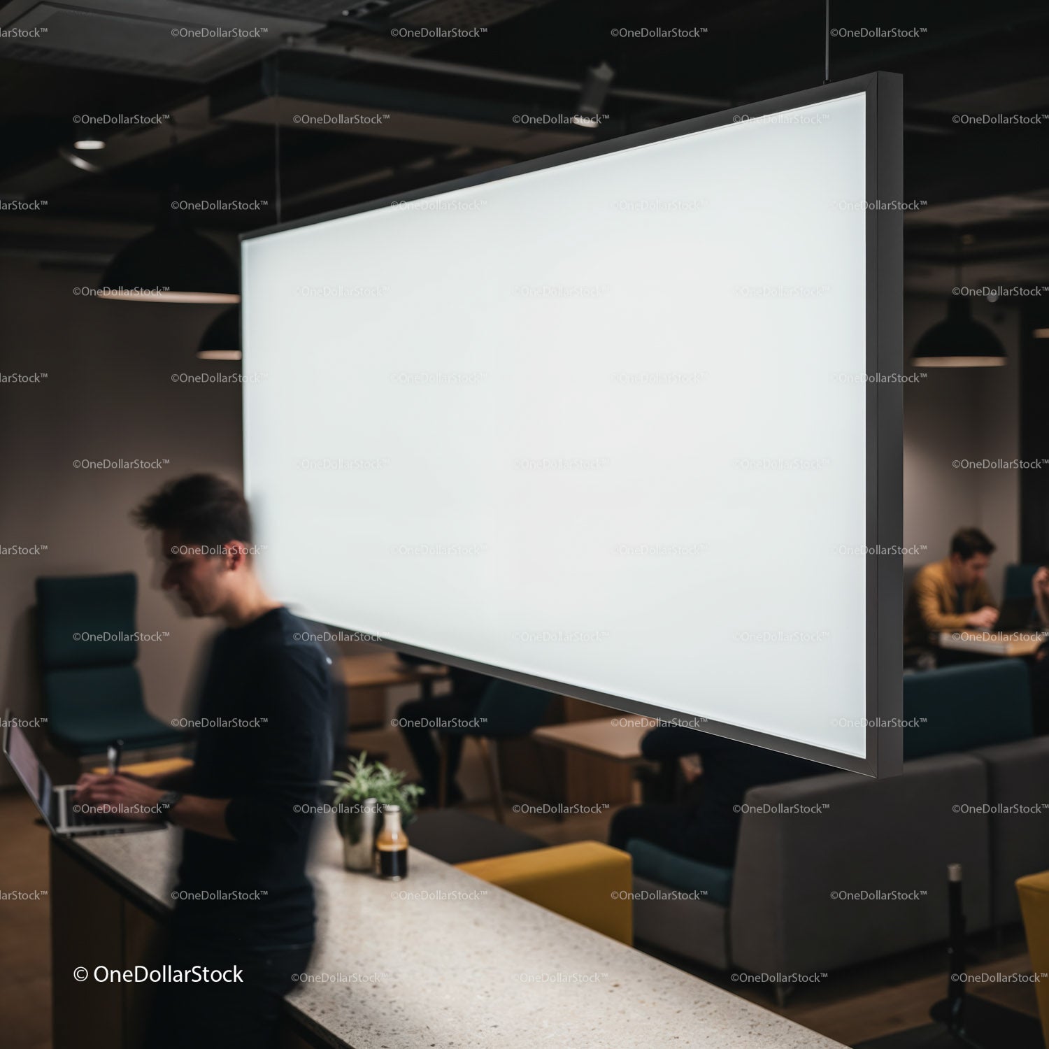 Modern coworking space with people working on laptops
