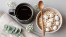 Cozy Breakfast Scene with Oatmeal Coffee and White Berries