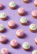 Delicate pastel cupcakes with heart sprinkles on lilac