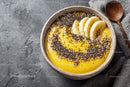 Delicious Yellow Smoothie Bowl with Banana and Chia Seeds