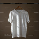 White Cotton T Shirt Hanging on Wooden Hanger