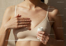 Close-up of a Woman Applying Body Oil for Smooth Skin and Radiance