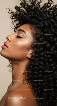 Profile of serene woman with voluminous curly hair