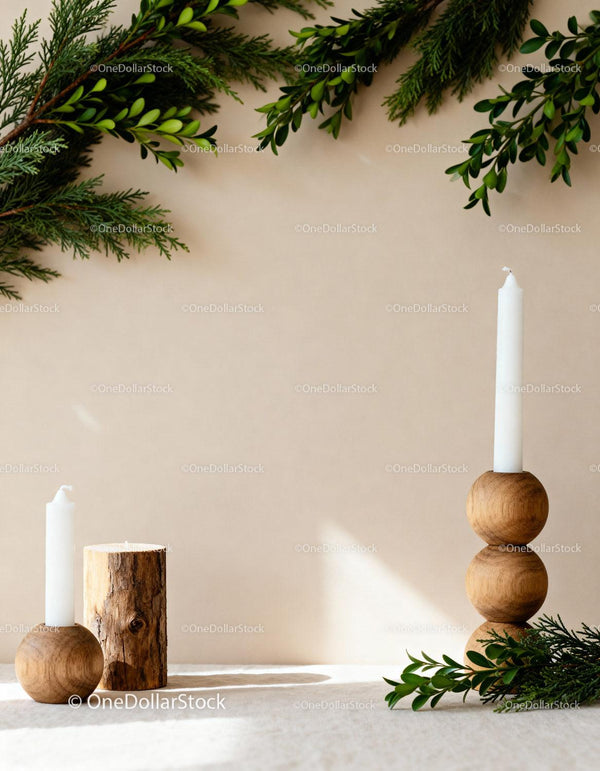 Minimalist wooden candle holders with green foliage decor
