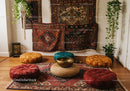 Cozy meditation space with vibrant cushions and rugs