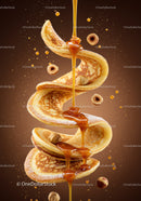 Golden pancakes with flowing caramel and hazelnuts