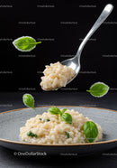 Creamy Risotto with Fresh Basil on Gray Plate