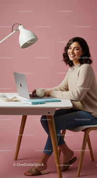 Smiling Woman Using Laptop in Modern Home Office Setup