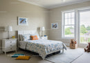 Bright Cozy Bedroom with Large Window and Playful Decor