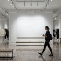 Modern boutique interior with woman walking past display