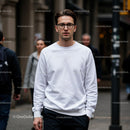 Young man walking confidently in urban street setting